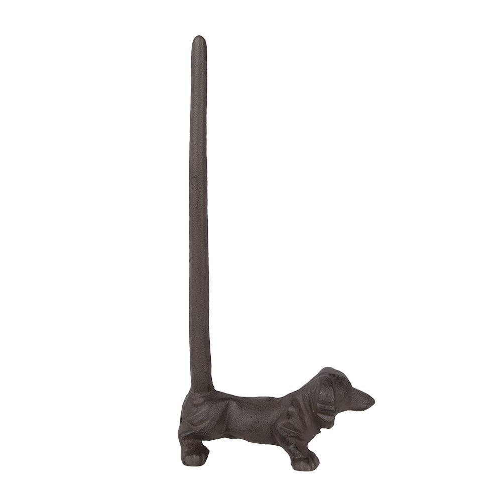 Detail van de bruine metalen honden keukenrolhouder voor op het aanrecht